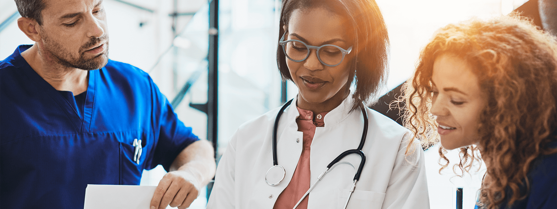 Doctors and nurses reviewing charts